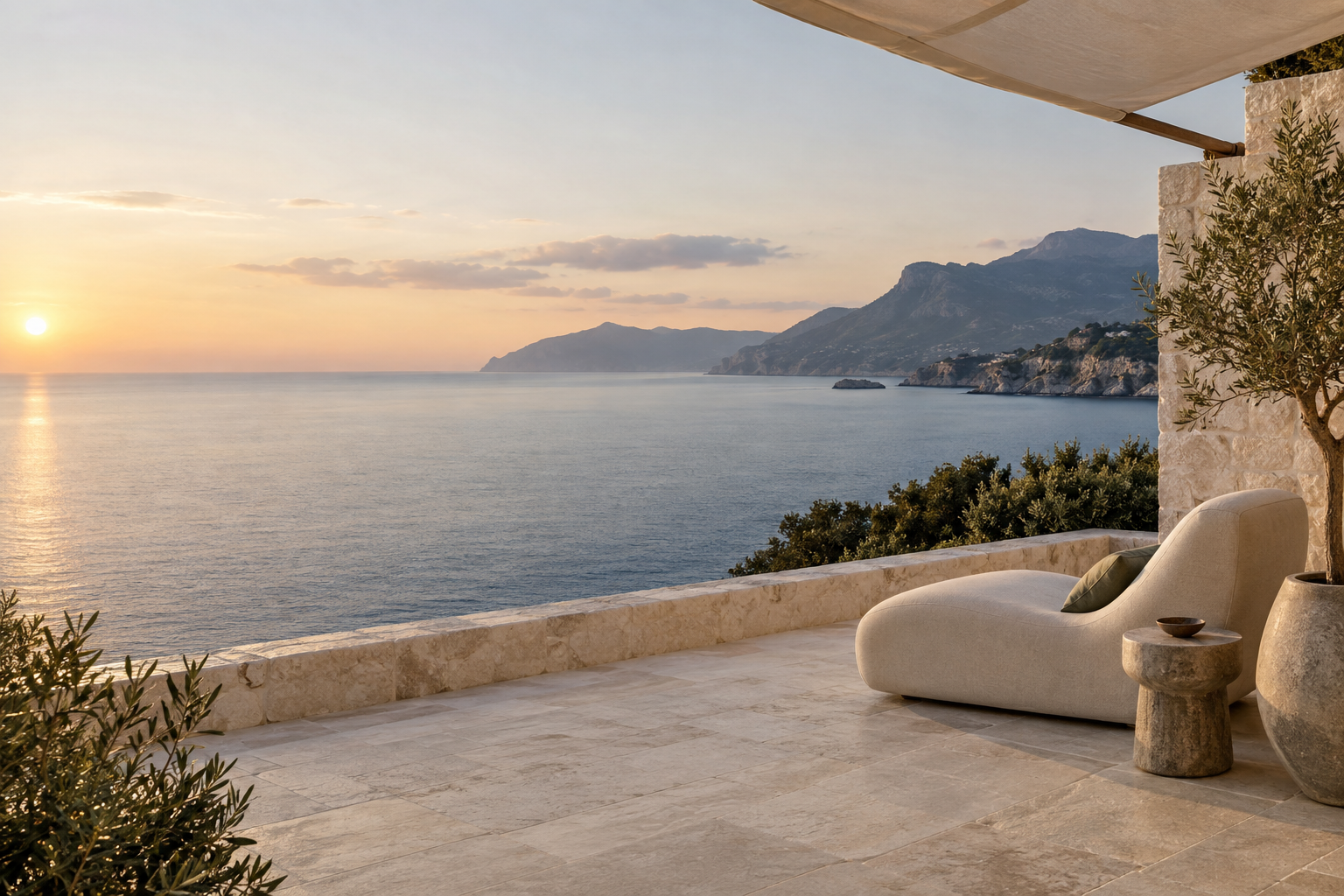 An open terrace overlooking a peaceful coastline at sunset